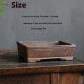 Rectangular purple sand bonsai pot on floor, showing simple five-line basin design.