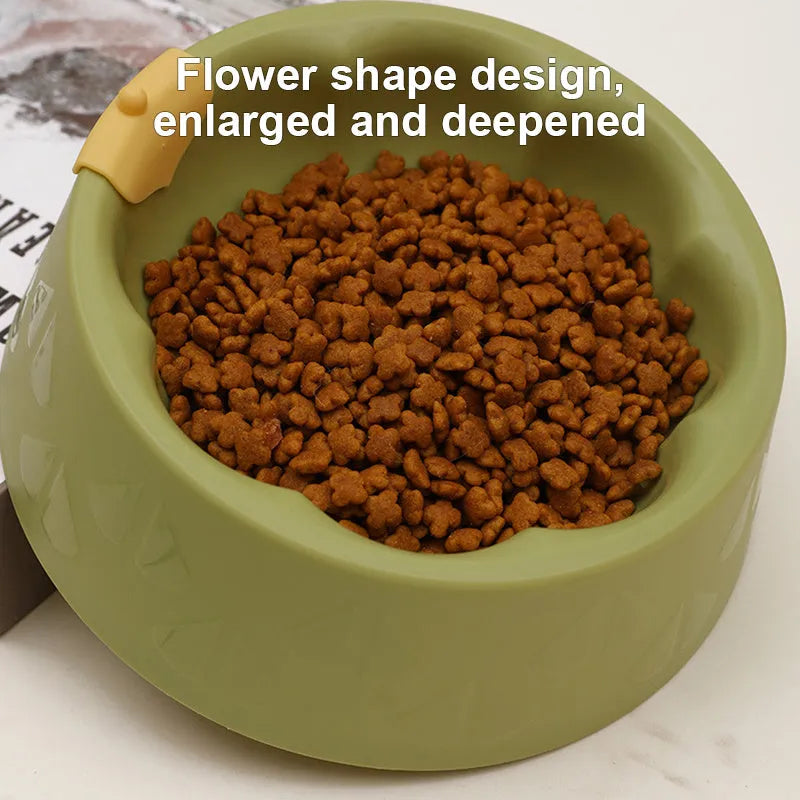 Green plastic double pet bowl with flower-shaped design and anti-tip base for cats and small dogs.
