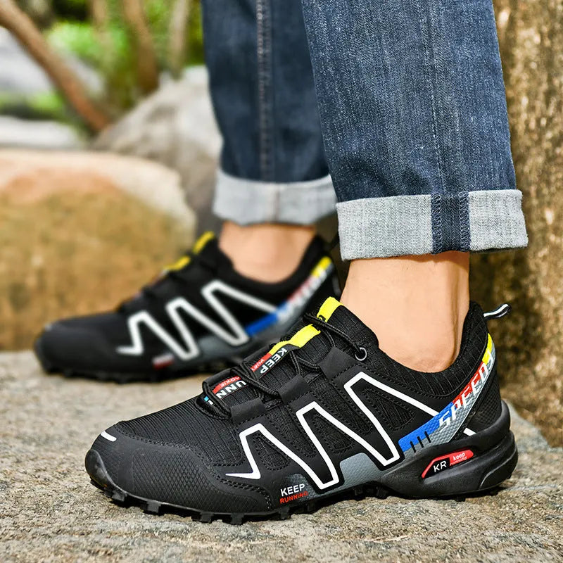 Men's grey orange and dark blue casual running shoes with low-top design on a white background.