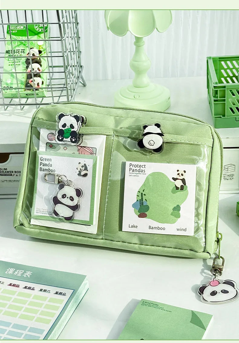 Green canvas panda pencil case showing twelve layered compartments open to reveal storage space