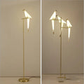 Paper crane lamp with iron lampshade, warm light, bird desk lamp on table.