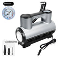 Compact black 12V portable car air pump with digital display and attached air hose.