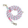 Woven rainbow pattern double-headed dog leash with metal fittings shown alongside mint green and blue purple colour options