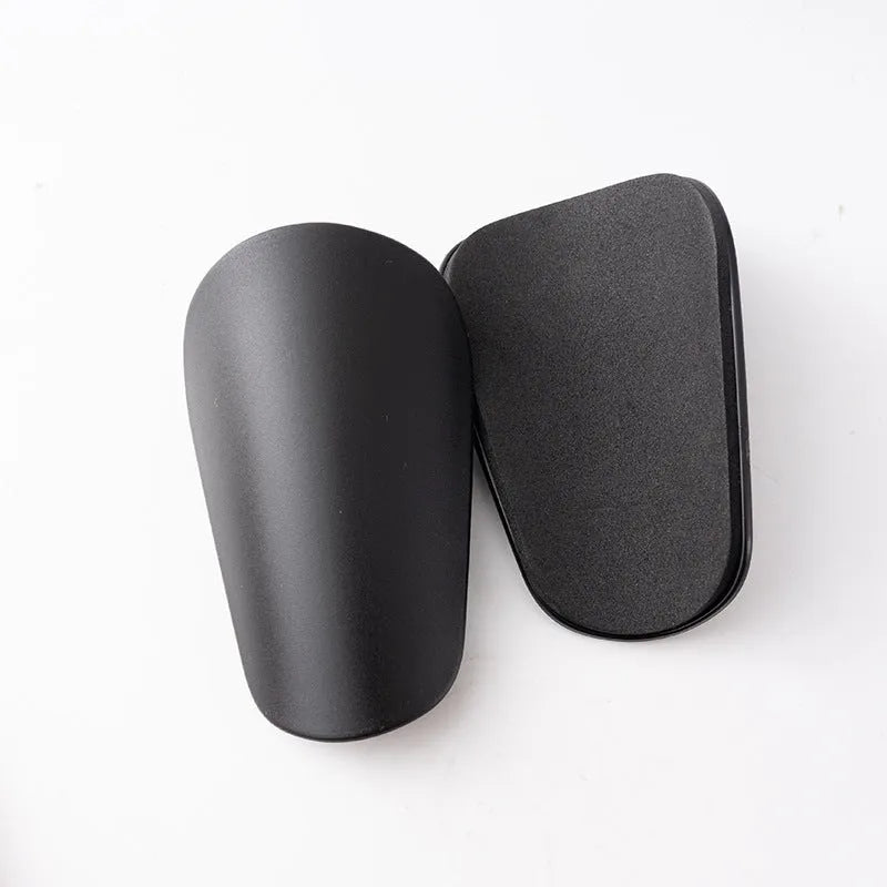 Pair of PU mini football shin guards for sports protection in various colours.
