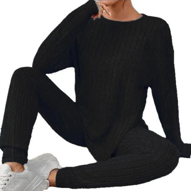 Black sunken stripe two-piece polyester homewear set with regular sleeves, showing top and pants.