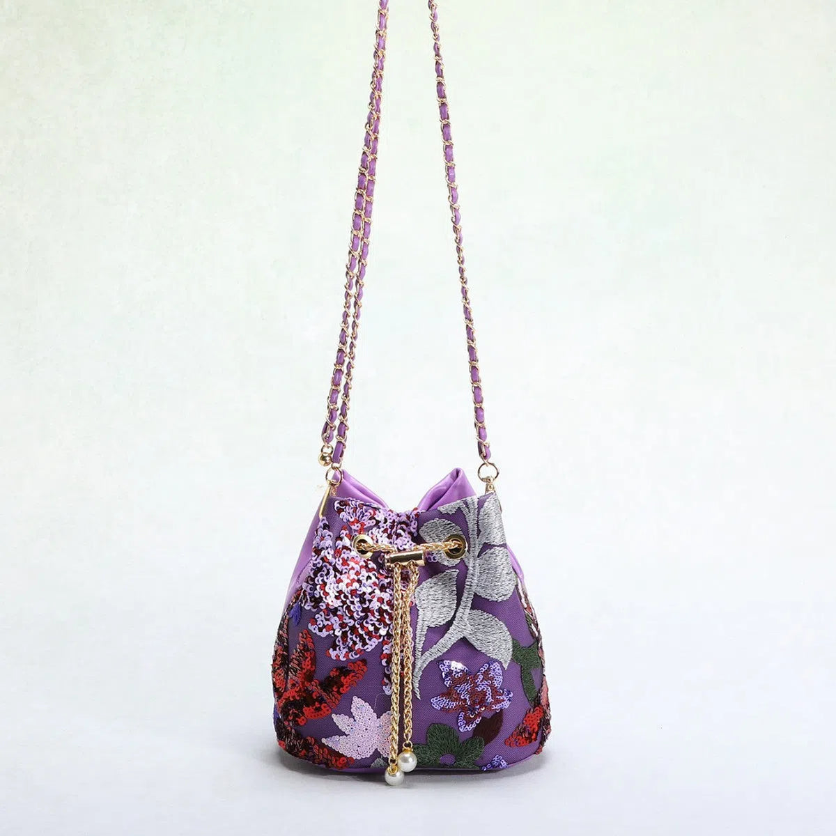 Bucket bag with mesh patchwork contrasting colours drawstring and chain strap in beige PVC material