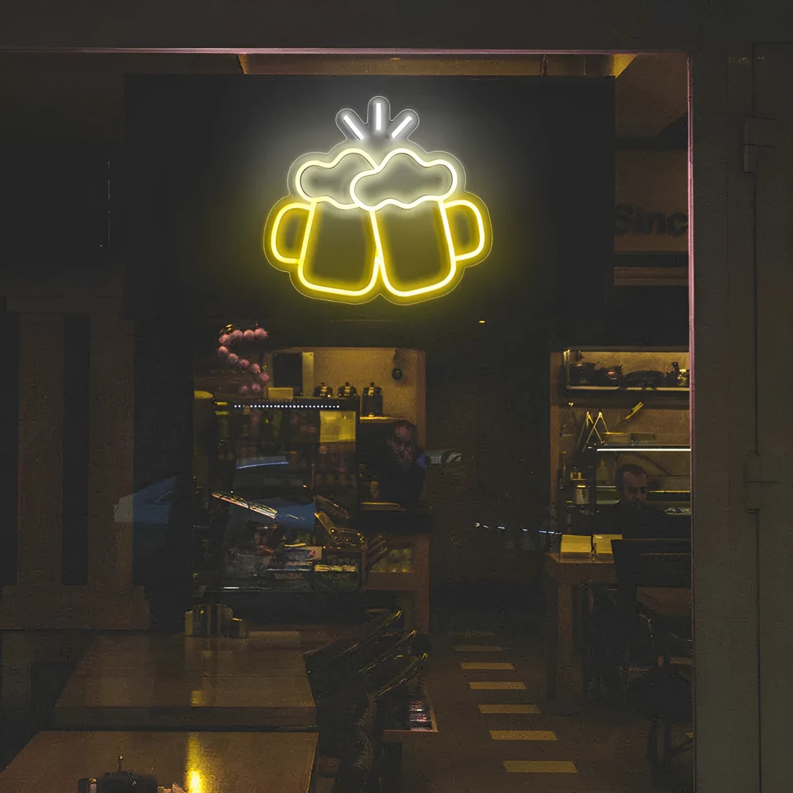 Yellow LED neon sign reading Bar Beer Cheers with acrylic background