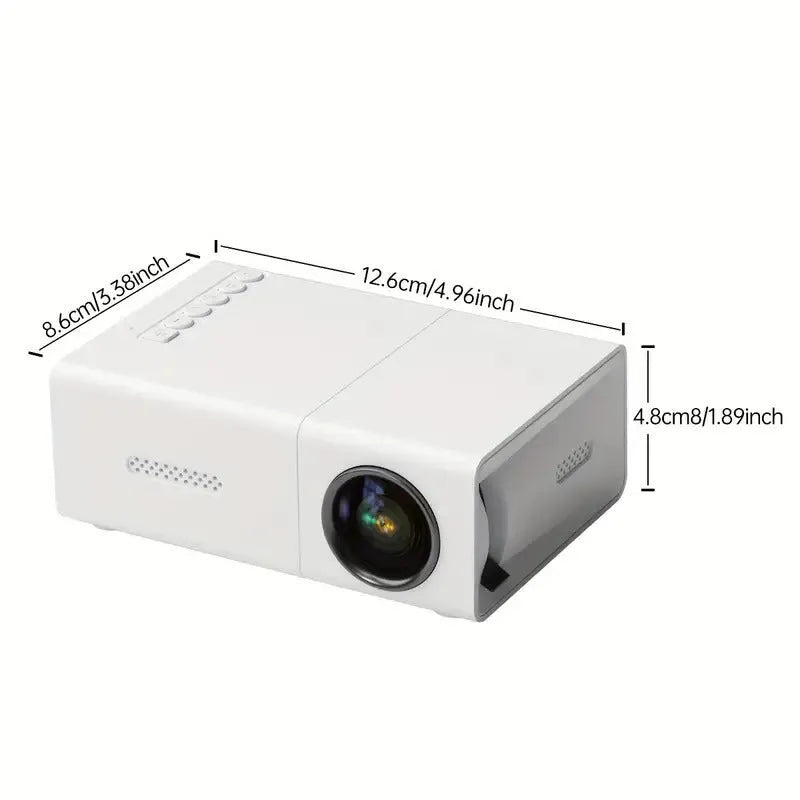 Black and white M100 mini portable LED home projector with remote control on a table.