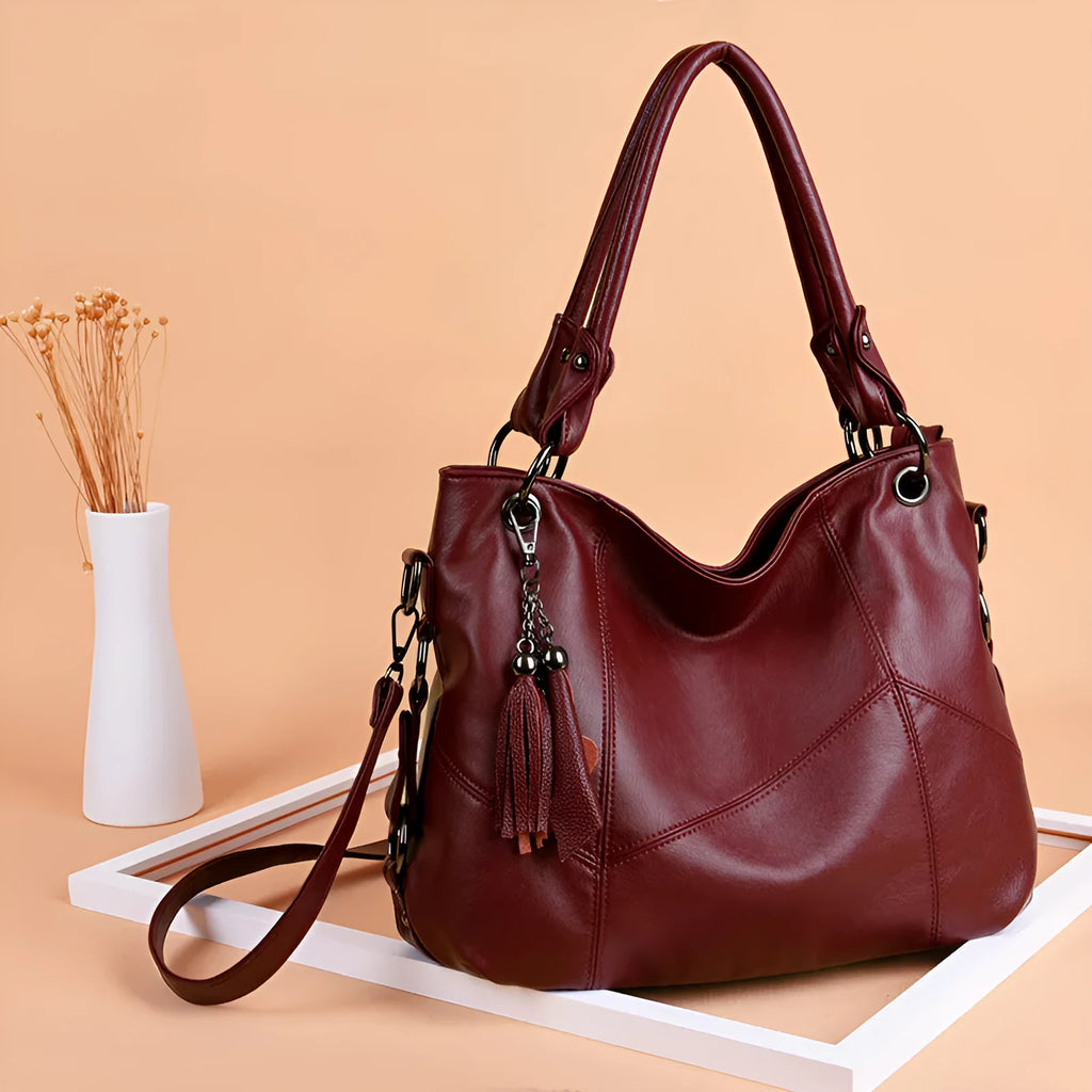 Women's PU tassel crossbody shoulder bag in bucket shape with three straps, available in black, blue, taro purple, wine red