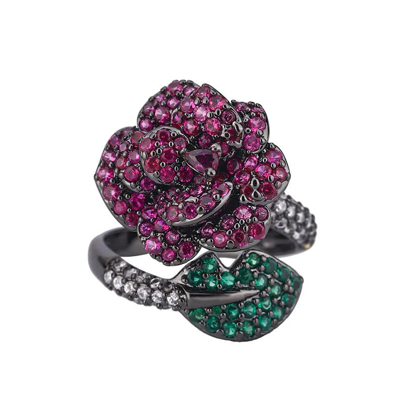 Geometric black gold ring with simulated red corundum stone and gold plating