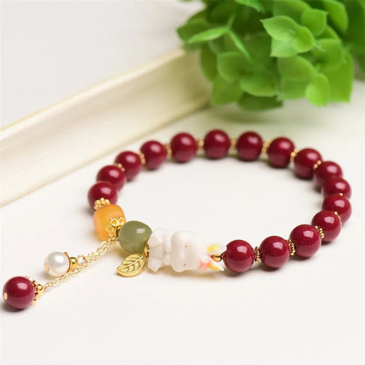 Tian Yu natural cinnabar bracelet with rabbit design in 8mm or 10mm sizes