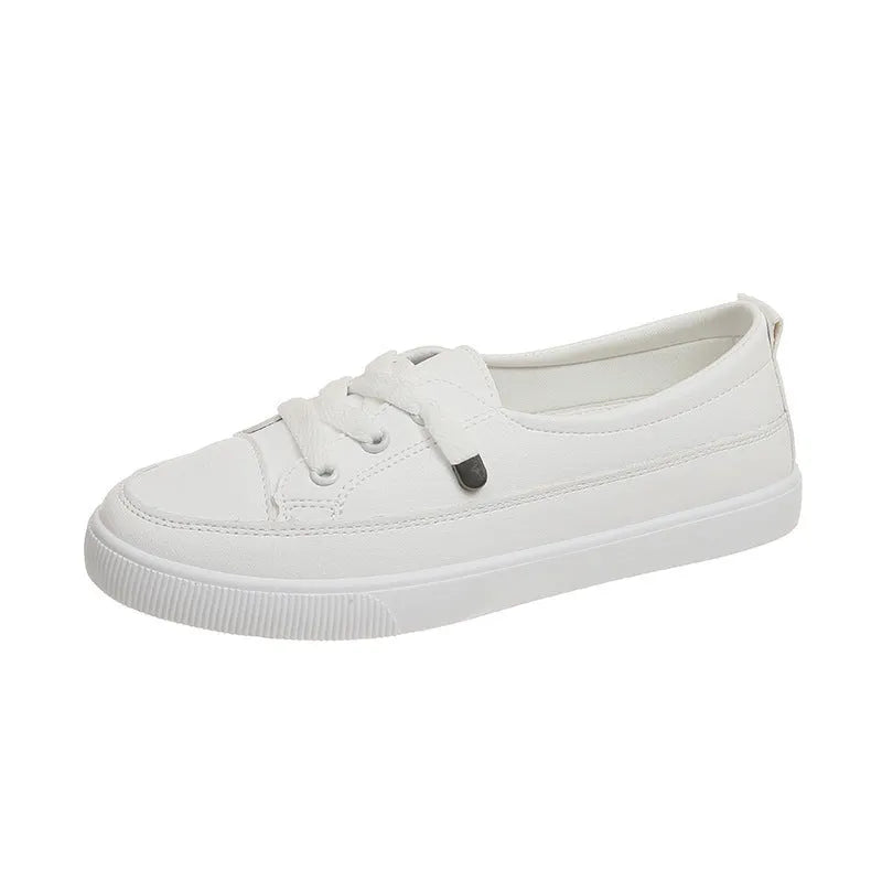 Women's casual lace-up shoes in white with round toe and rubber sole, side view