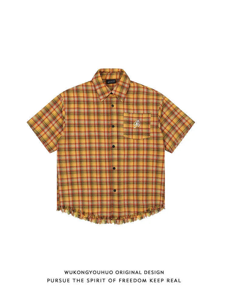 Yellow plaid short sleeve shirt with embroidered pocket detail and loose fit design