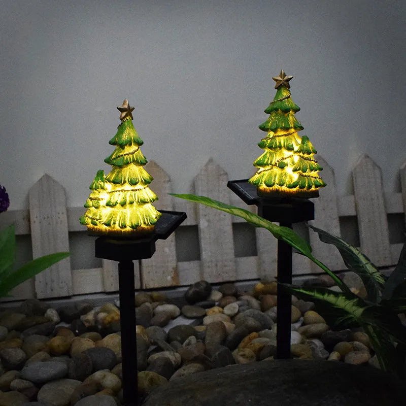 Solar powered Christmas tree shaped ground plugged lawn lamp with resin body and solar panel for outdoor garden decoration