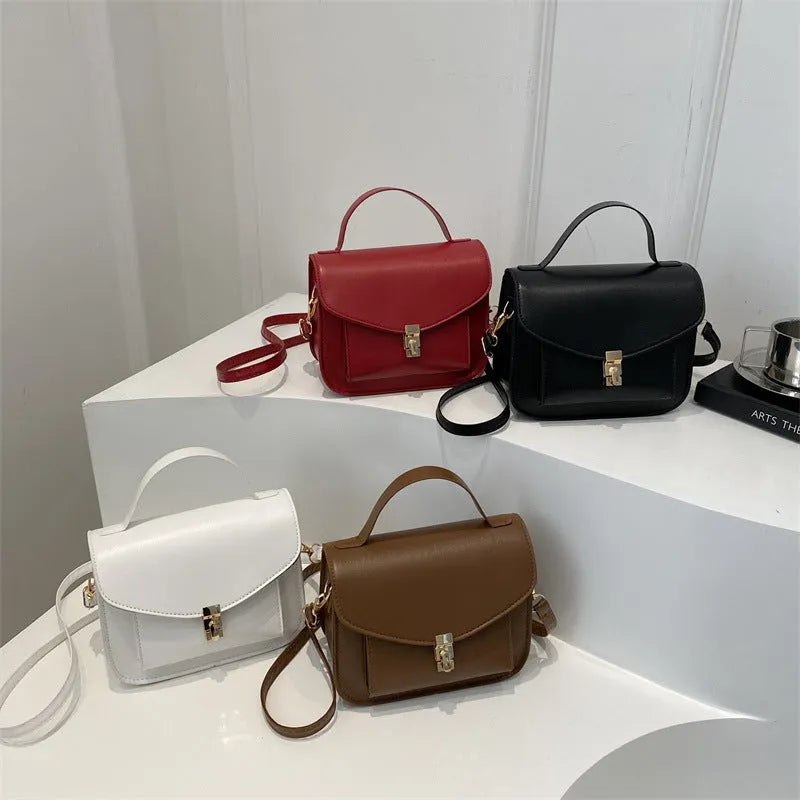 Retro style square messenger bag in PU leather, shown in black colour with visible sewing lines.