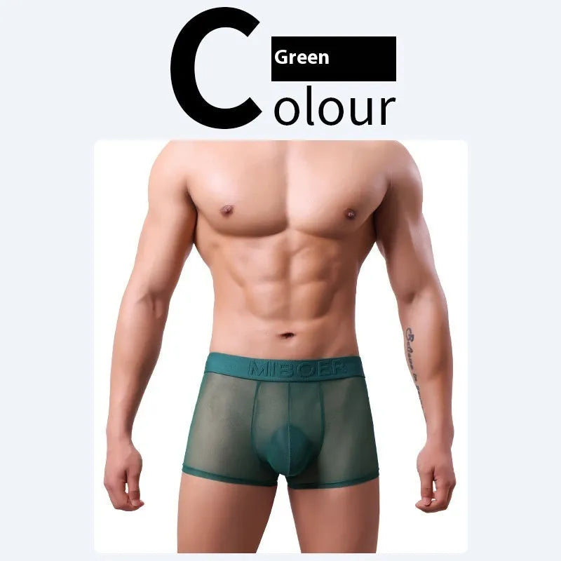 Men's thin polyester boxer shorts in solid colours including black, white, blue, and pink