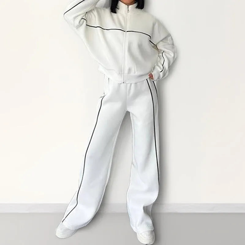 Casual polyester suit set showing a long sleeve mock neck hoodie and striped trousers on a model.