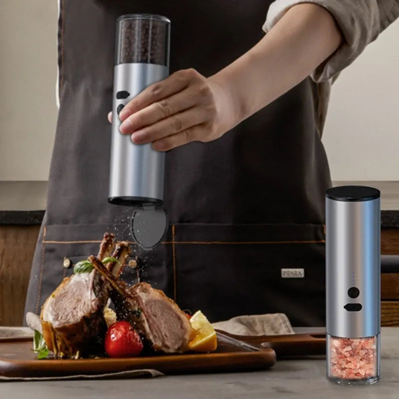 White and black electric salt and pepper grinders with USB charging ports and clear glass jars