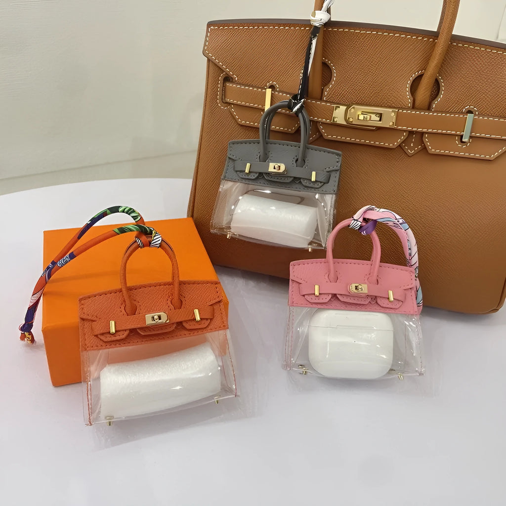Women's fashion car key case in artificial leather showing crocodile print and palm print pattern options.