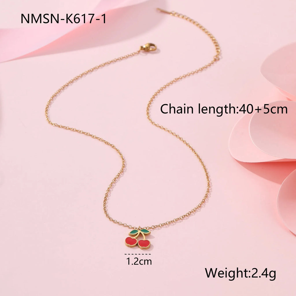 Complete cherry jewellery set showing stainless steel necklace, bracelet, earrings, and ring with 18K electroplating