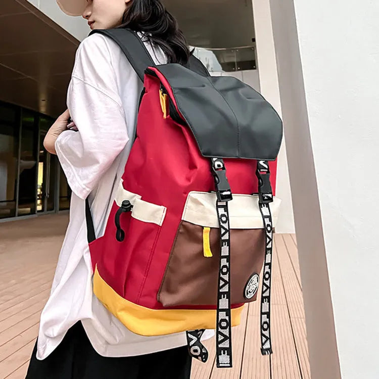 A mid-size black Oxford cloth backpack shown with handheld and two-shoulder carry options.