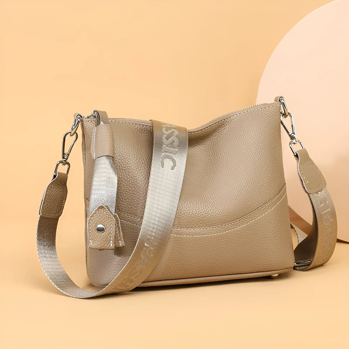 Genuine leather crossbody bag in black, horizontal square shape with splicing detail and multiple internal pockets.