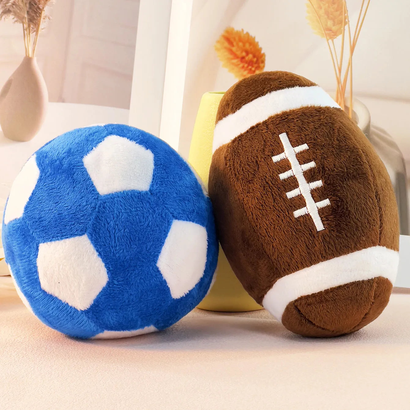 Plush football and rugby interactive puppy training toys in two colour options