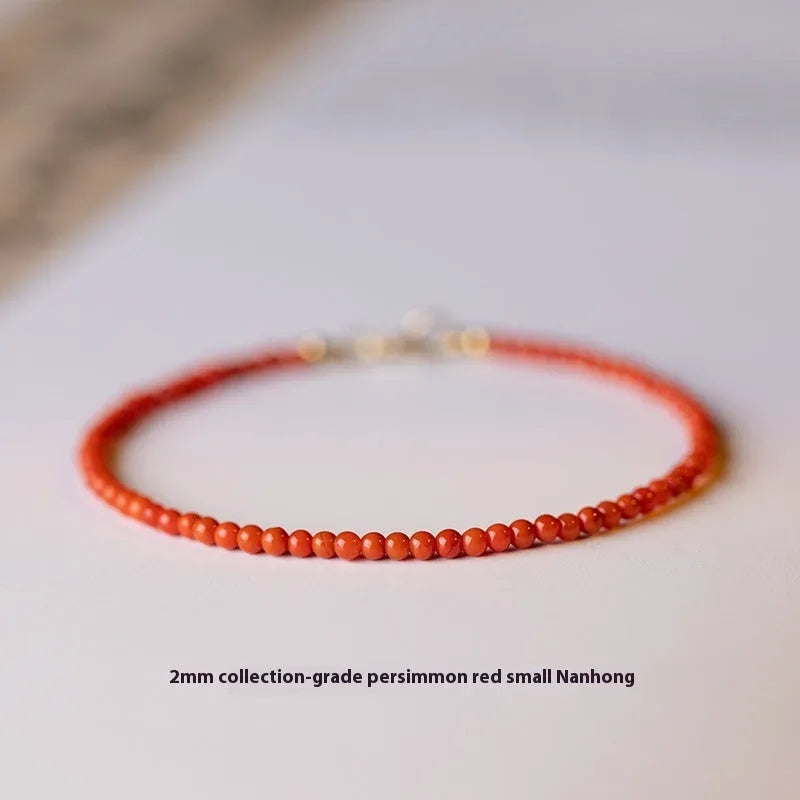 Women's natural Southern Red agate bracelet with Cherry Red 3mm cut surface beads on white background
