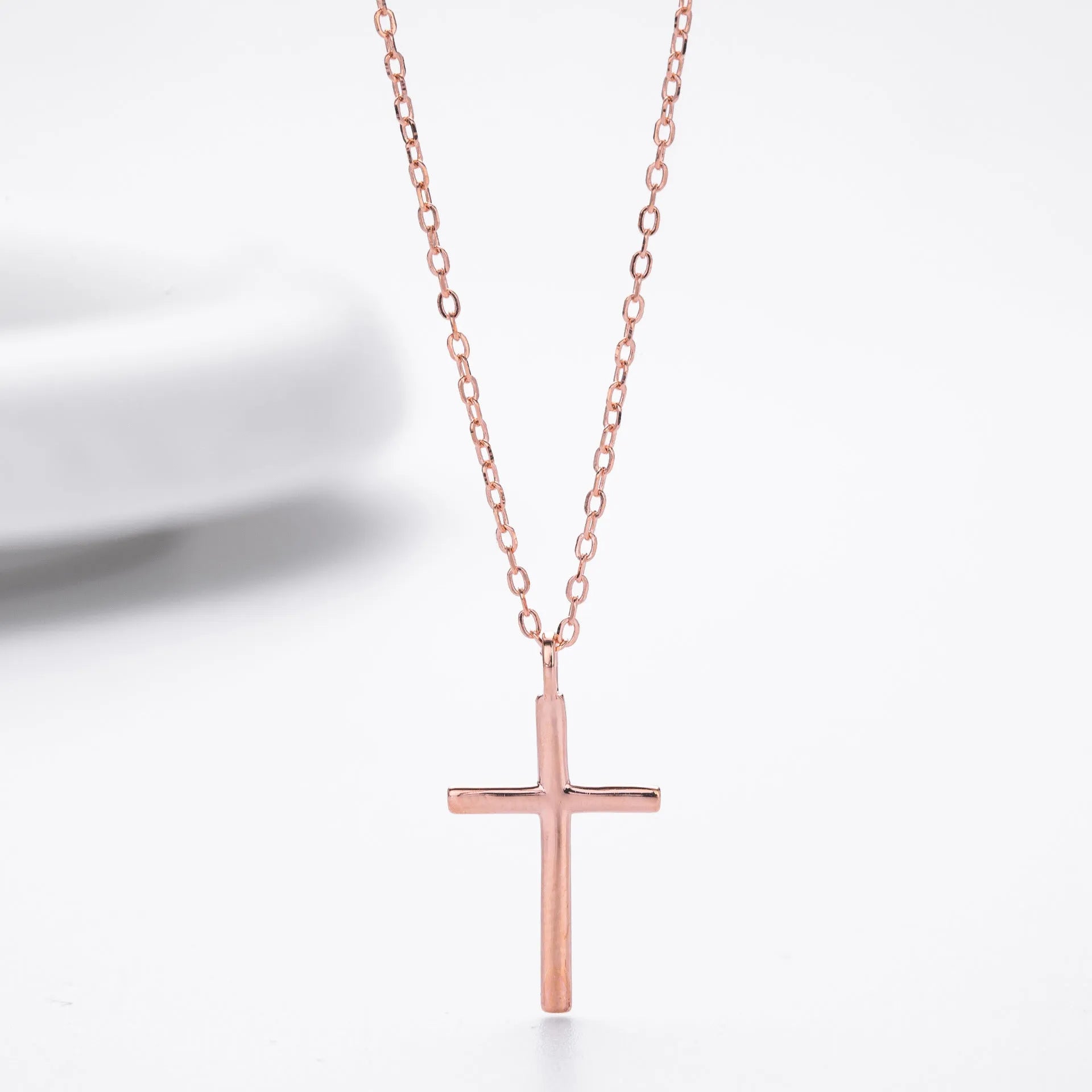 S925 sterling silver cross pendant necklace on an adjustable O-chain, shown in gold plated finish.