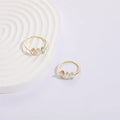 Mother's Day birthstone ring with geometric triangle design and horse eye tricolour zircon stones in 14k gold colour