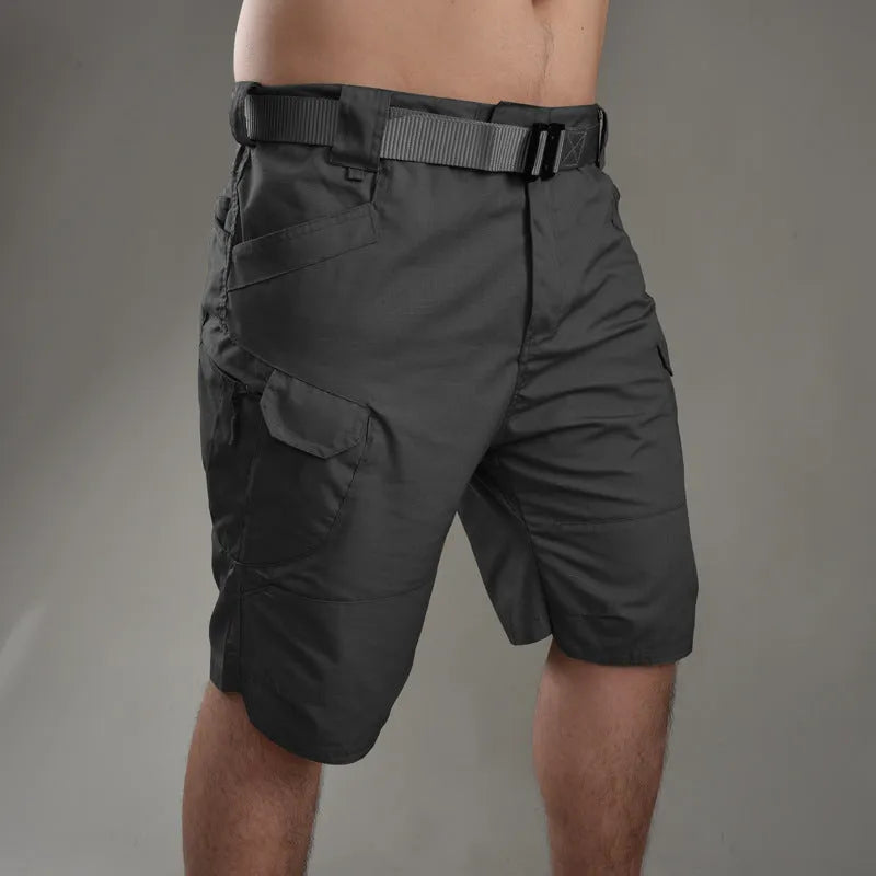 Men's khaki tactical shorts with button closure for hiking and outdoor work.