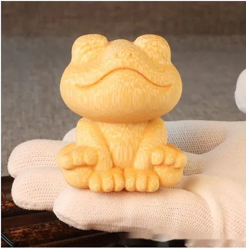 Solid bamboo carved smiling frog ornament with cartoon cute style, measuring 5cm high.