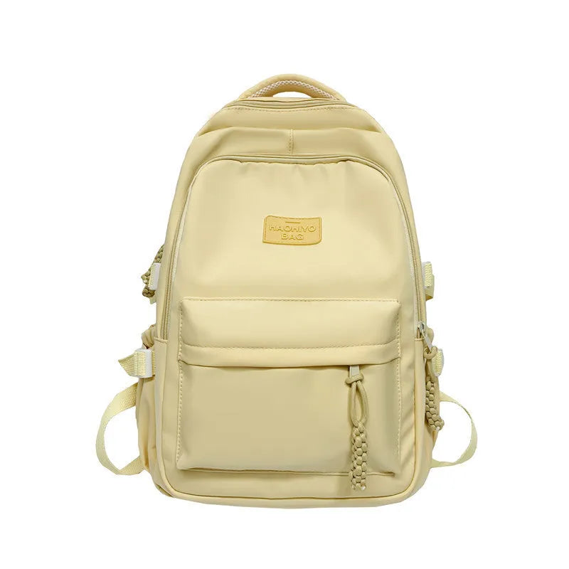 Korean-style lightweight nylon waterproof school backpack in beige with curved shoulder strap