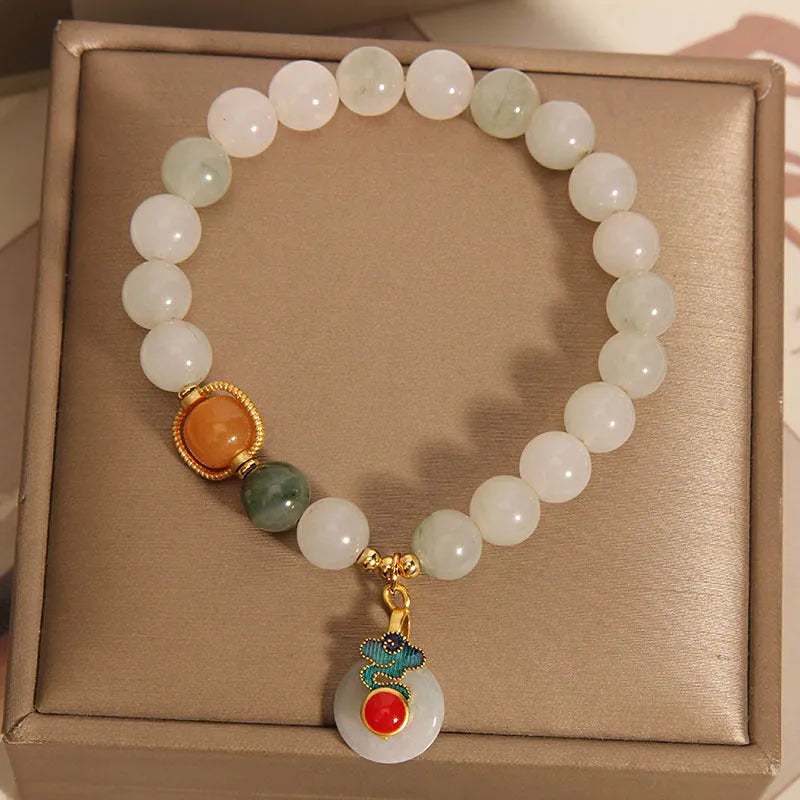 Women's ice jade crystal bracelet with a pearl and a detailed Xiangyun peace jade buckle.