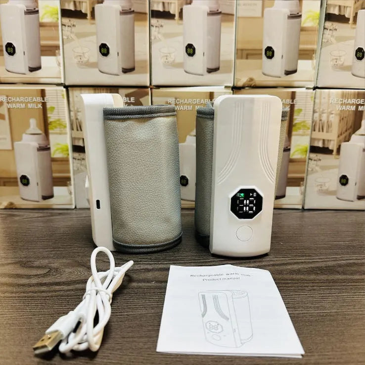 Grey and white electric milk warmer for car use with 12V charger plug.