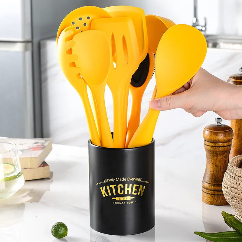 Yellow silicone and nylon 4-piece cooking utensil set with spoon and spatula for nonstick cookware
