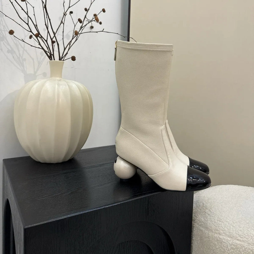 Women's chunky heel ankle boots with elastic fabric upper in black, white, and apricot side view