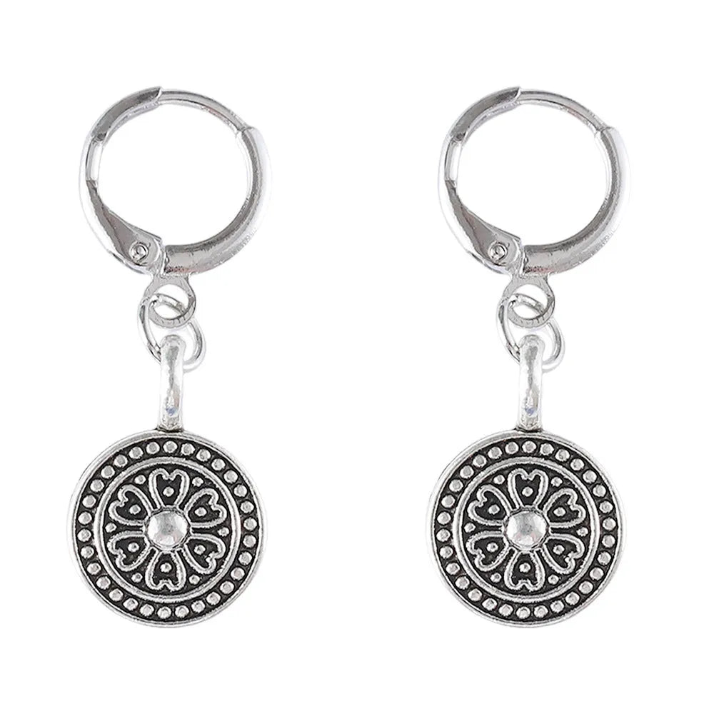 A pair of geometric Bohemian-style retro earrings with a distressed round ethnic print on zinc alloy.