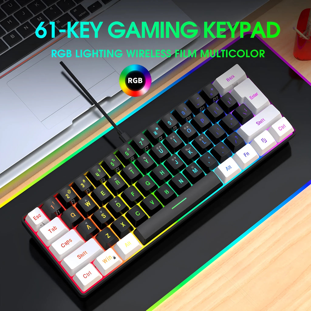 White and black wired 61-key USB membrane keyboard on a desk next to a laptop.