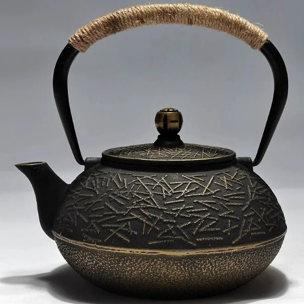 Japanese style cast iron teapot with decorative patterns in 0.9 litre capacity