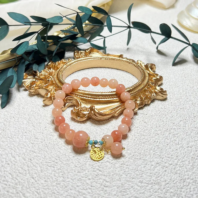 Pink natural stone charm bracelet with adjustable alloy chain for women