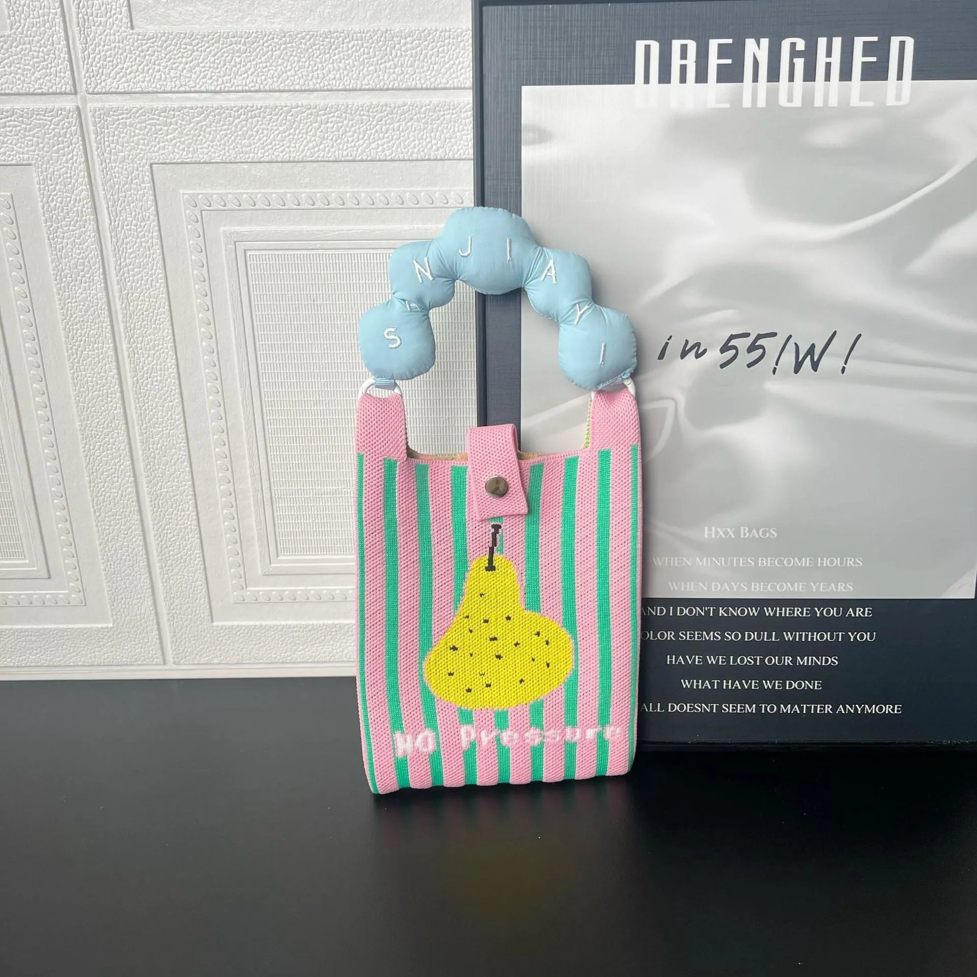 Cartoon knitted messenger bag with woven design and single shoulder strap