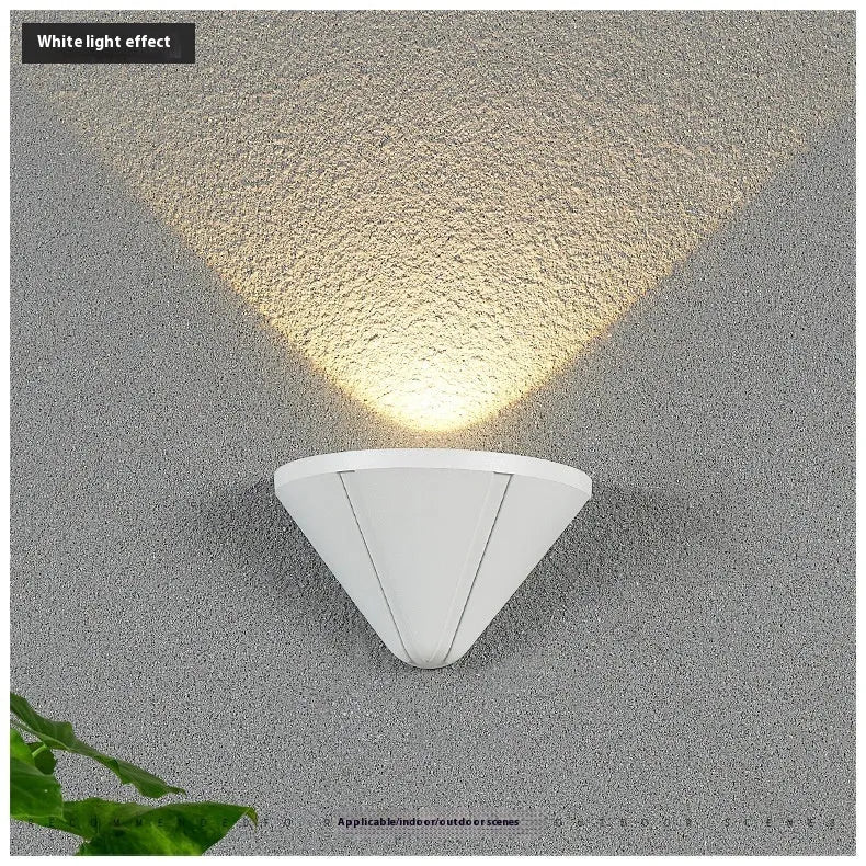 Black bird's nest style aluminium alloy LED lamp with warm white glow.