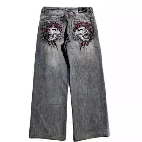 Grey washed wide-leg jeans with straight-leg workwear styling and mid-waist zip fly