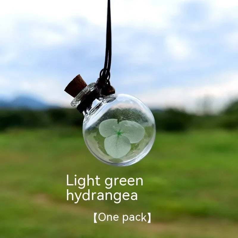 Glass car perfume pendant with preserved flowers for interior decoration and air freshening
