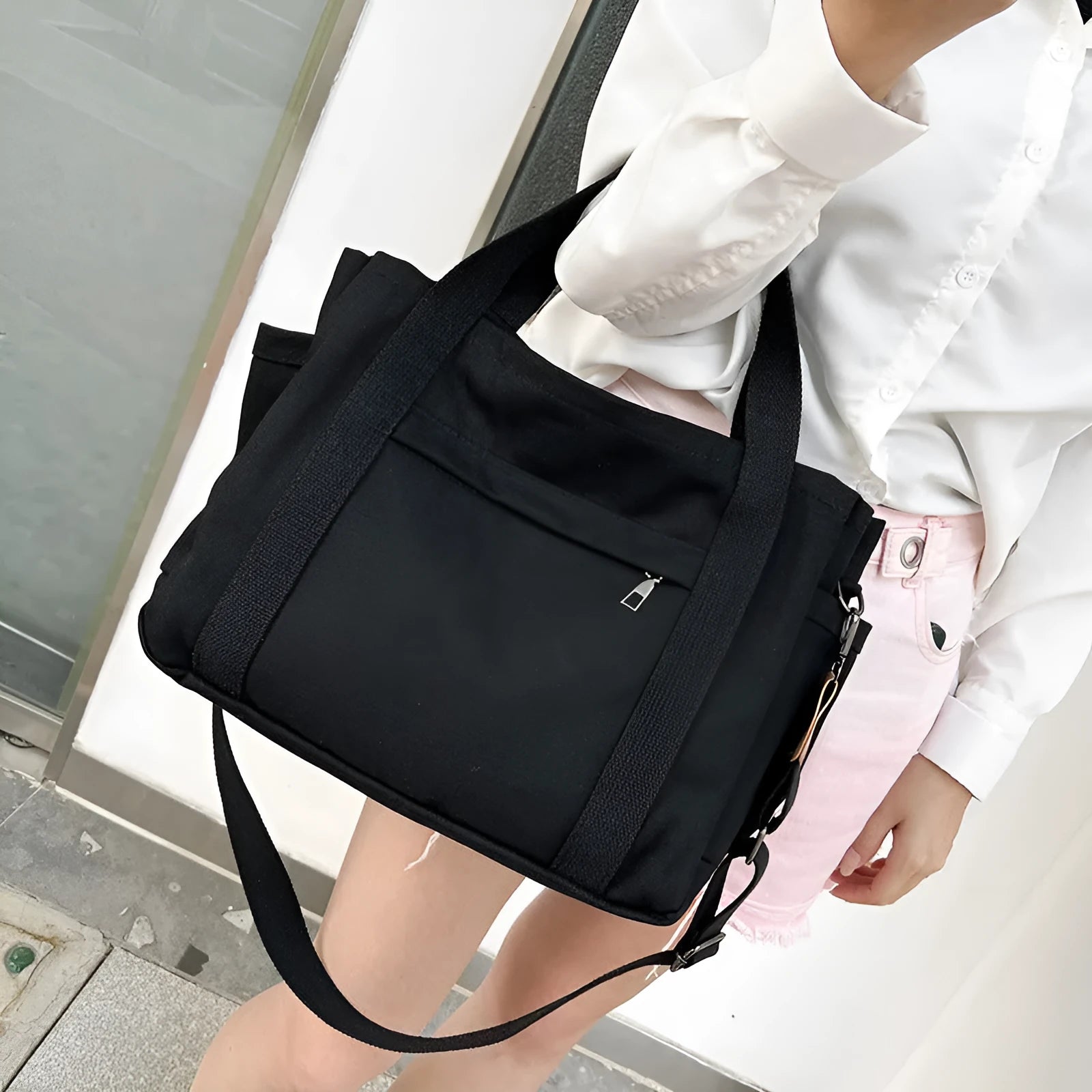 Canvas tote bag with internal organisation pockets for phone, documents, laptop, and camera in horizontal square shape