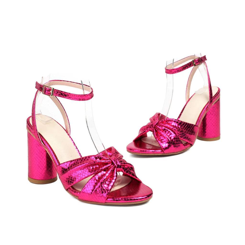 Gold women's plus-size high heel peep toe sandals with an ankle buckle strap on a white background.