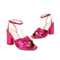 Gold women's plus-size high heel peep toe sandals with an ankle buckle strap on a white background.