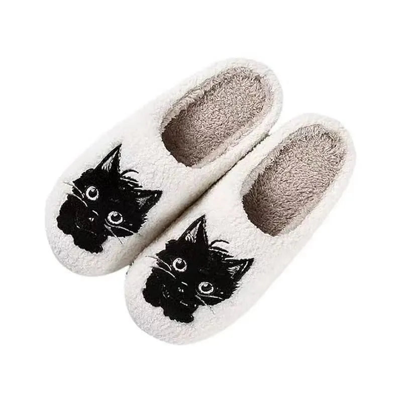 White plush slippers with a Black Beard Cat cartoon design on the toe.