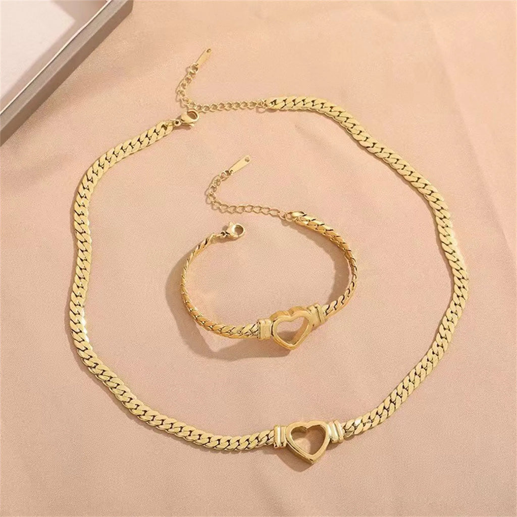 Gold titanium steel personalised love chain necklace and bracelet set with Cuban links and heart shape on white background